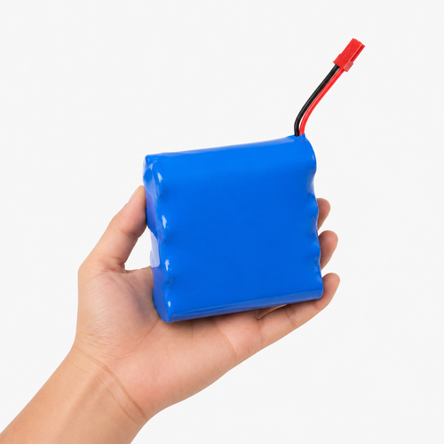 Blue battery held in a hand against a white background Portable cooler compatible Blue battery with a red terminal on a white background for long haul power of cooling for temperature sensitive materials like insulin peptide and etc